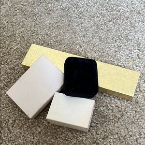 Assorted Vintage Jewelry Boxes in Gold, White, and Black